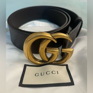 Brown textured Gucci belt with gold buckle. Used size 100, or 36 waist